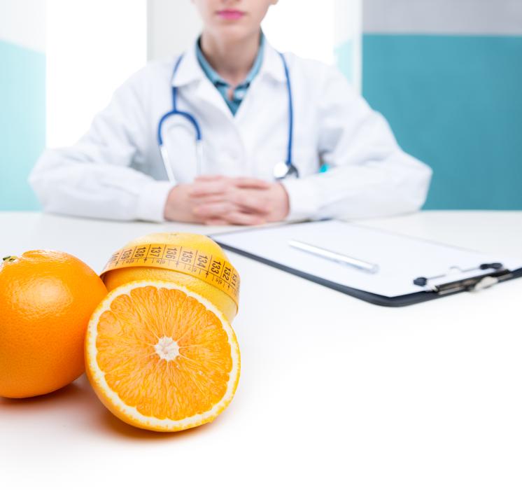 dentist sitting behind desk with oranges | beaverton dentist