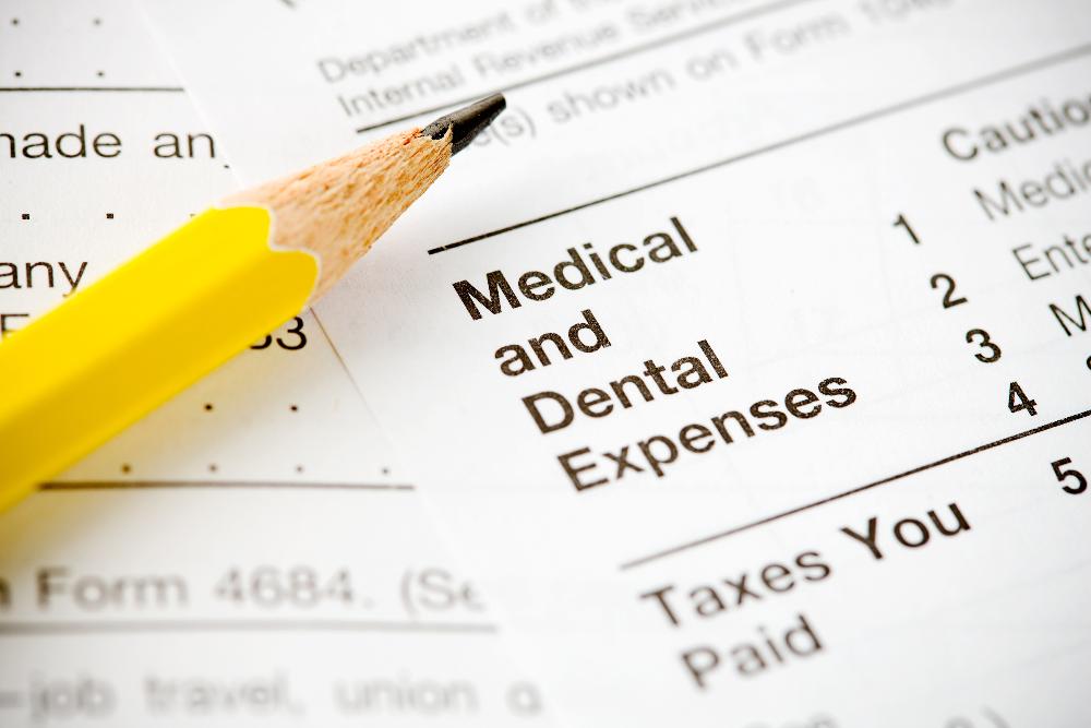 close up of financial documents | dentist near me