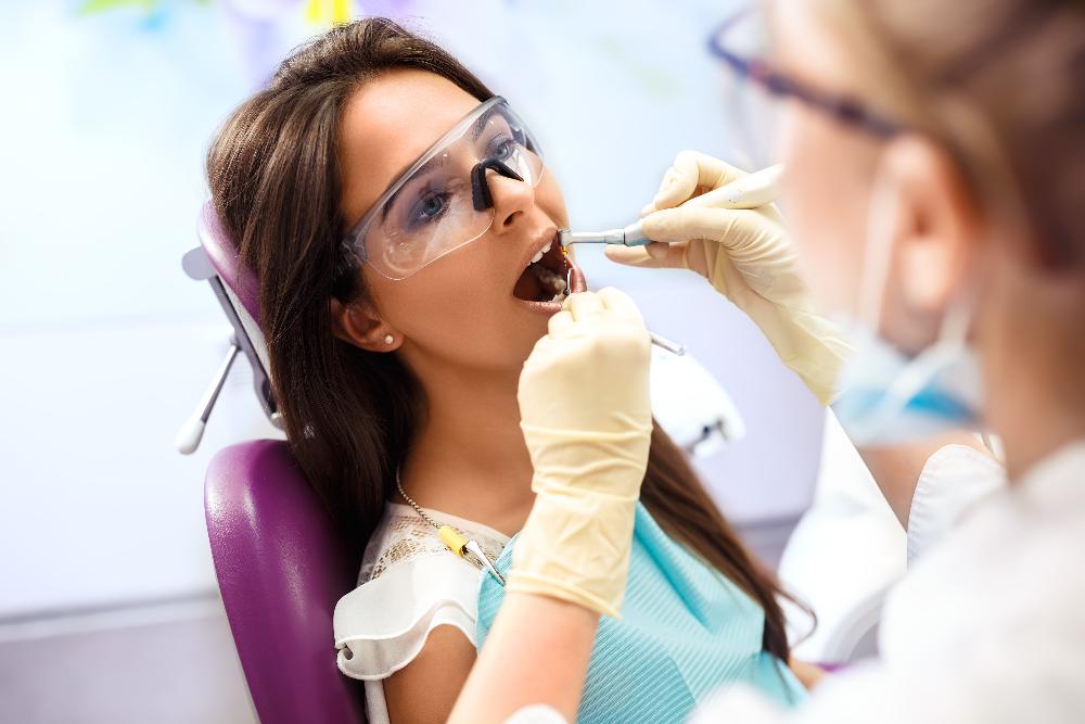 patient receiving dental exam | tooth extraction beaverton or