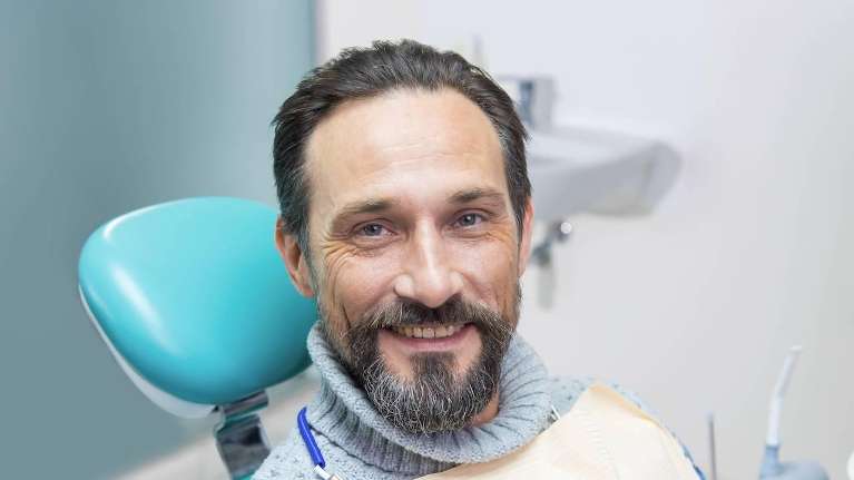 A patient smiling after visiting dental cleaning | dental cleaning beaverton or