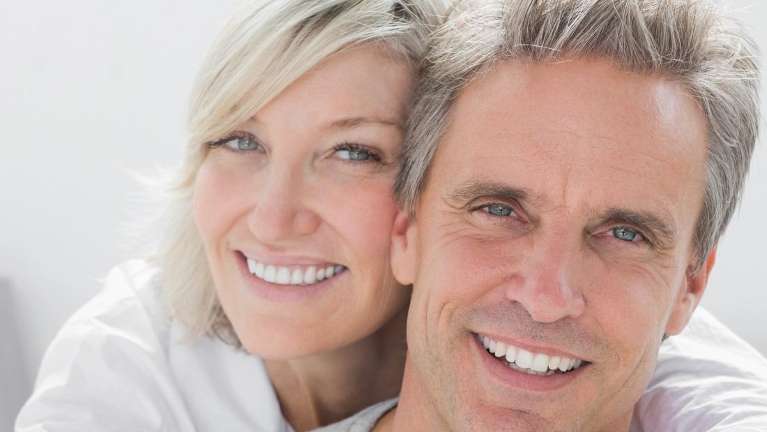 older couple hugging | dentist near me