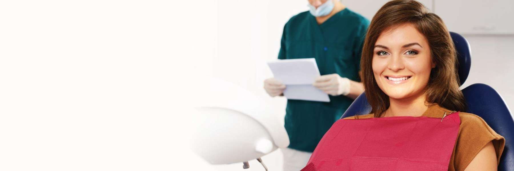 woman smiling in dental exam chair | beaverton dentist